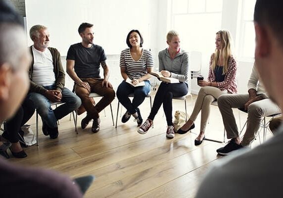 people engaging in a coaching circle session