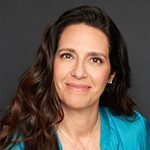 Headshot of Graziela “Gra” Cajado-Ogland, PCC and Secretary/Treasurer with the International Coaching Federation. With a background in global leadership and executive coaching, she empowers leaders to navigate transitions.