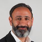 Headshot of Kaveh Mir-Tahmasebi, ACTC, MCC, Treasurer, and Global Professional Coaches Board Director with the International Coaching Federation. Known for fostering positive behavioral change and enhancing performance, engagement, and leadership transitions.