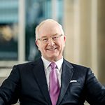 Headshot of James “Jim” Wetrich, PCC, Vice Chair, and Global Board Representative with the International Coaching Federation. With 43 years in healthcare leadership and a passion for coaching, he drives impactful change.