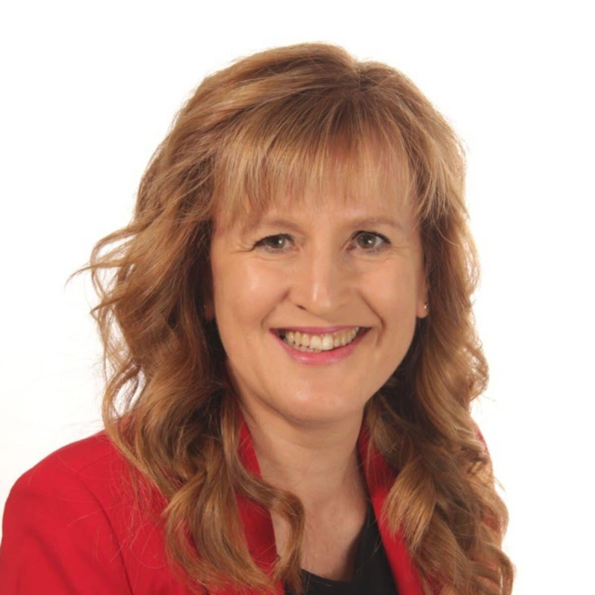 Headshot of Rossella + Pin, author with the International Coaching Federation. Known for for her "everything is possible" attitude, making her an inspiring learning leader and speaker.