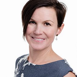 Dr Pauline Johnson Zielonka headshot photo, dark haired woman smiling against a white background
