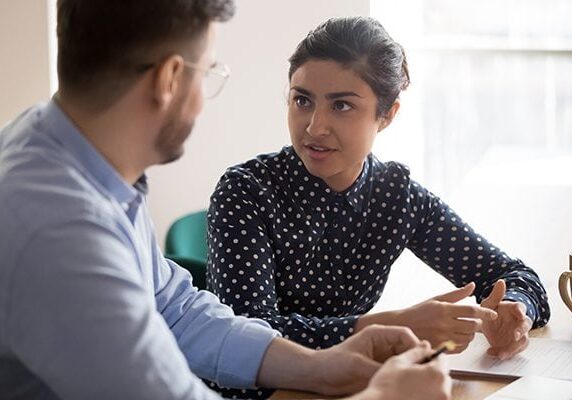 woman looking at a man in conversation