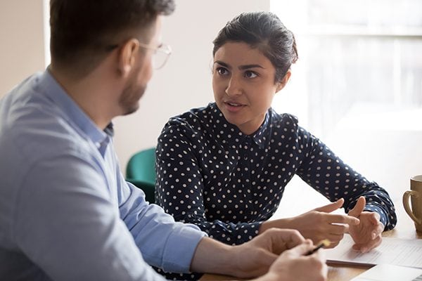 woman looking at a man in conversation
