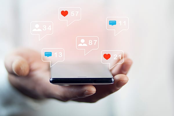 cellphone with chat bubbles and notification symbols