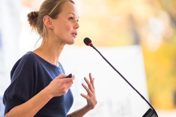 female speaker at a podium