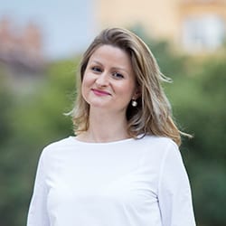 Svetoslava Stoyanova ACC headshot photo, blond woman smiling with white top on