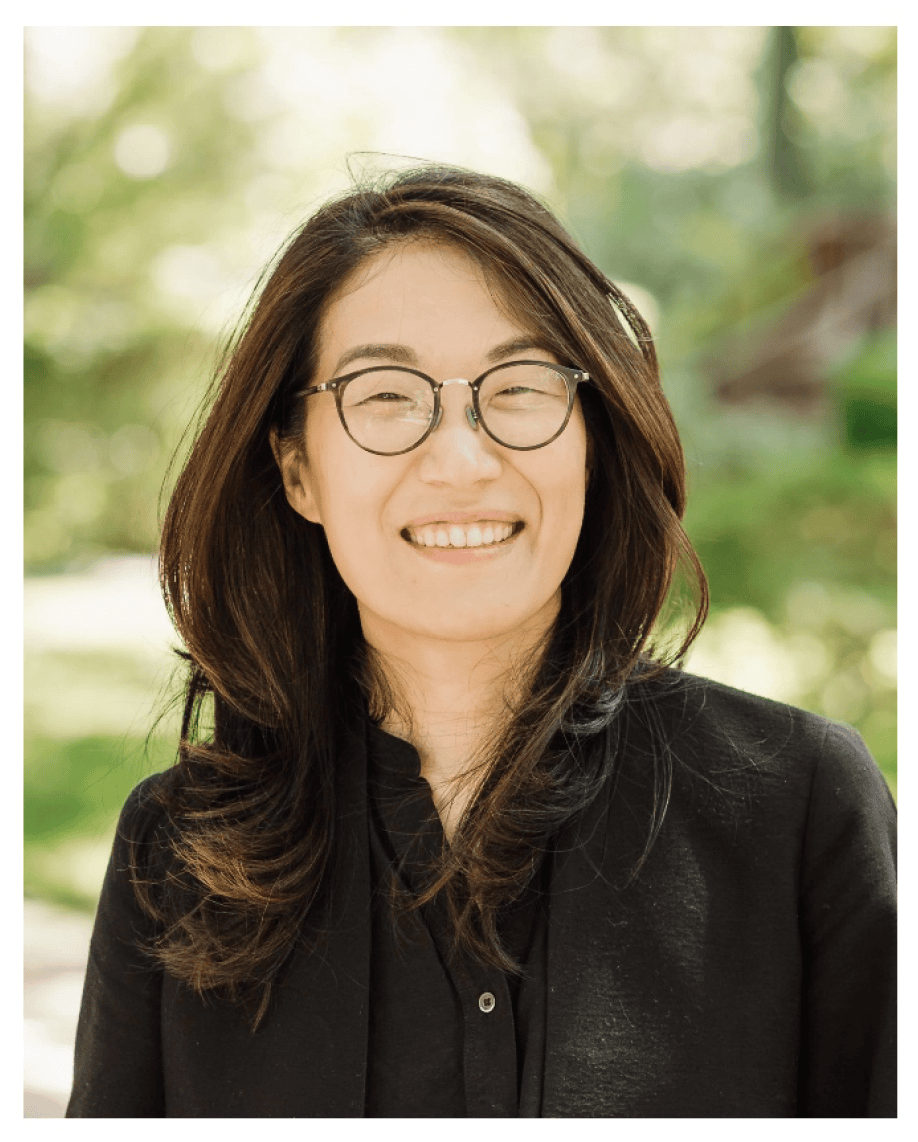 Haesun Moon headshot photo, smiling woman with dark hair wearing dark shirt outside